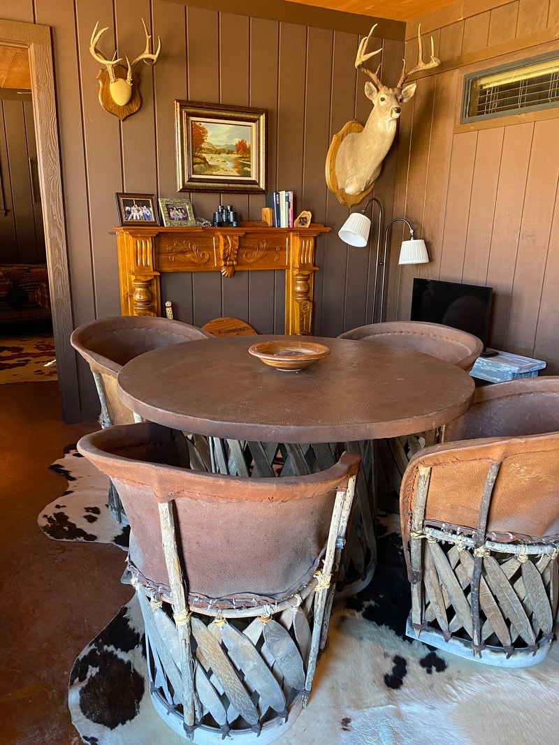 Rustic dining room with deer mounts