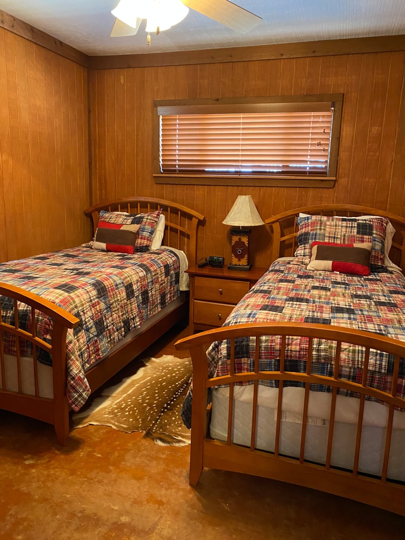 Rustic bedroom with twin plaid beds